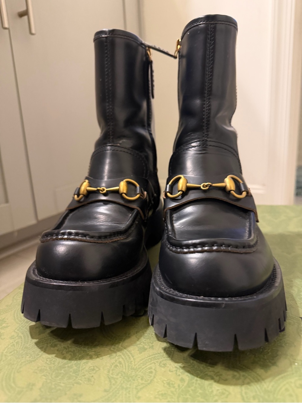 Gucci Black Leather Lug Sole Ankle Boots with Gold Horsebit Detail